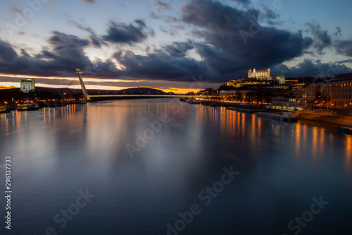 Bratislava's famous restaurant on top of the bridge captured in full sunset © Michal