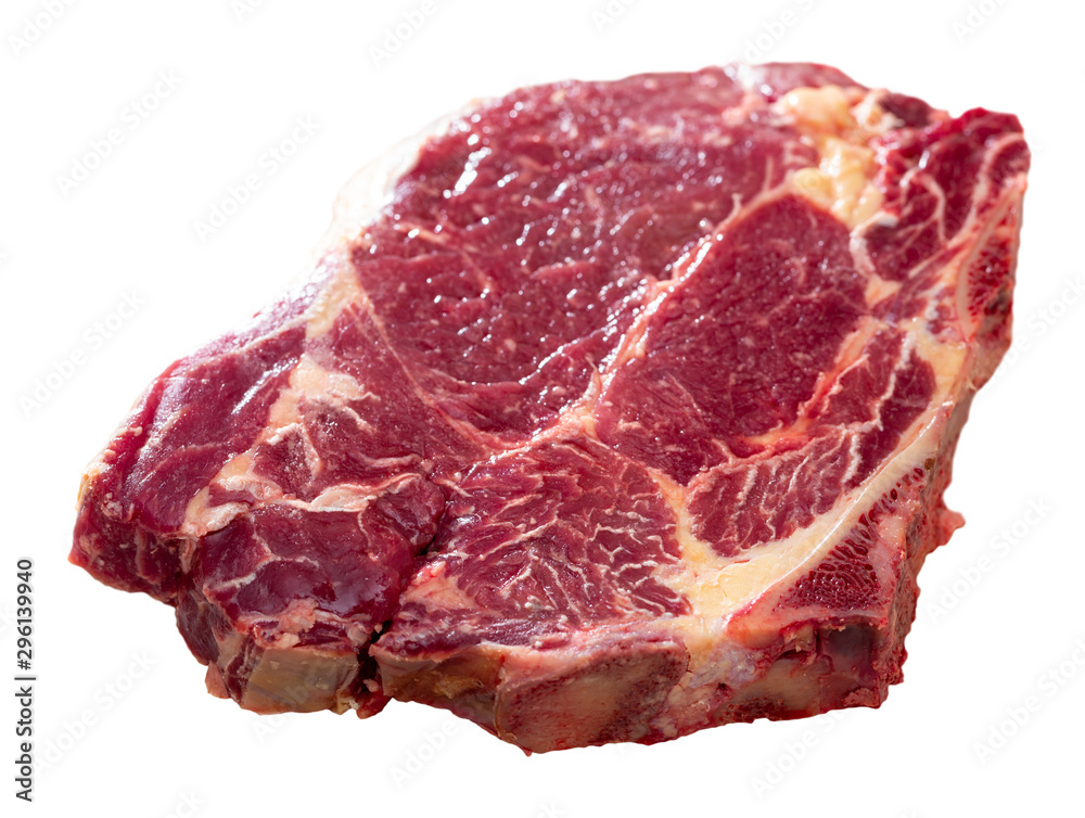 Fototapeta premium Raw cow chop on natural wooden surface, before cooking