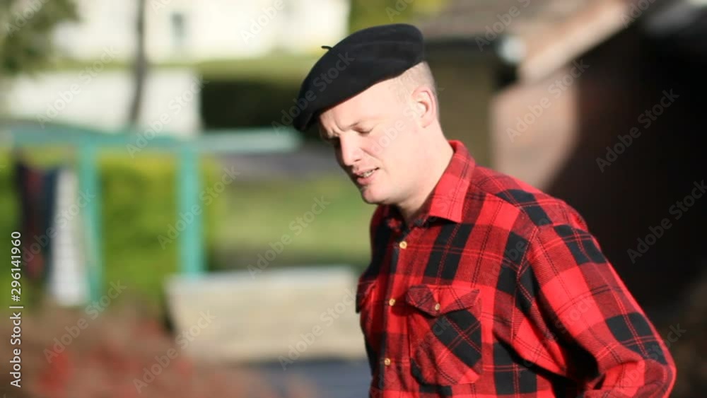 Handsome Man entering a wooden Chalet wearing plaid shirt. A beautiful and peaceful cozy cottage in the valley with burning wood. A green Adventure lifestyle Handsome Man entering a wooden Chalet wearing plaid shirt. A beautiful and peaceful cozy cottage in the valley with burning wood. A green Adventure lifestyle