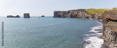 View over Dyrholaey Cliffs from the Famous Black Beach of Reynisfjara, Iceland photo