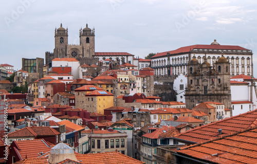 Cityscape image of Porto, Portugal, with old town Ribeira before sunset.