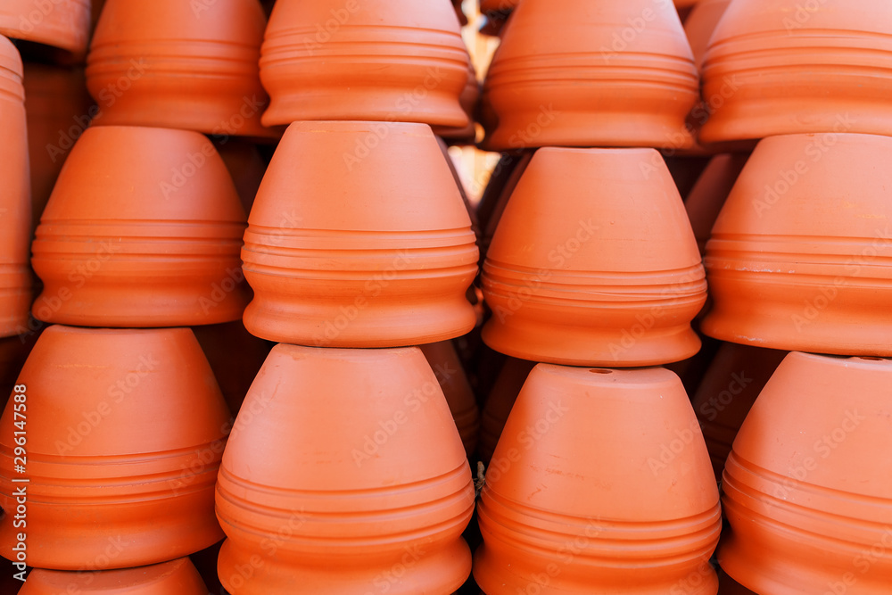 Handmade ceramic crockery made of clay of brown terracotta color Handmade ceramic crockery made of clay of brown terracotta color