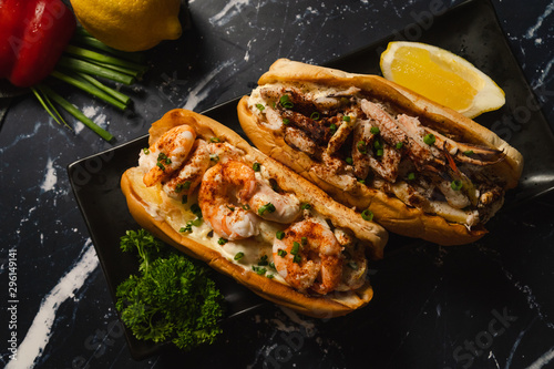 Top view of Crab roll and Shrimp roll on black plate
