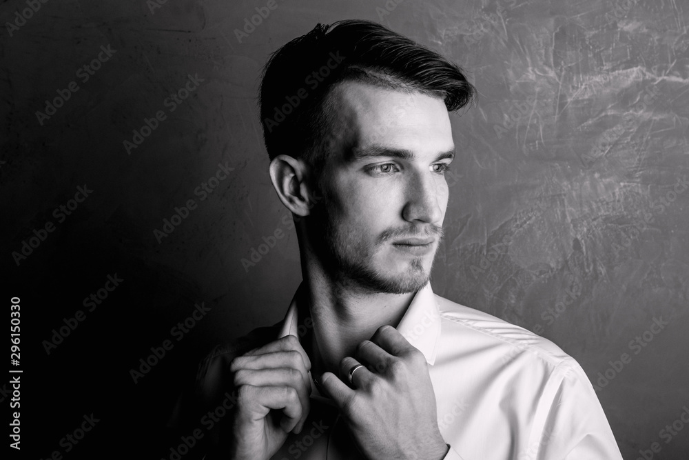 Fototapeta premium Portrait of a young guy black and white