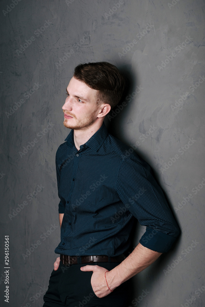 Portrait of a bearded man in a dark-colored shirt. Portrait of a bearded man in a dark-colored shirt.