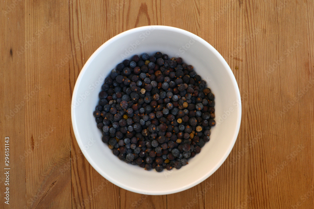 Healthy dried berries in a ceramic bowl on the wooden table. Concept of healthy food. Healthy dried berries in a ceramic bowl on the wooden table. Concept of healthy food.