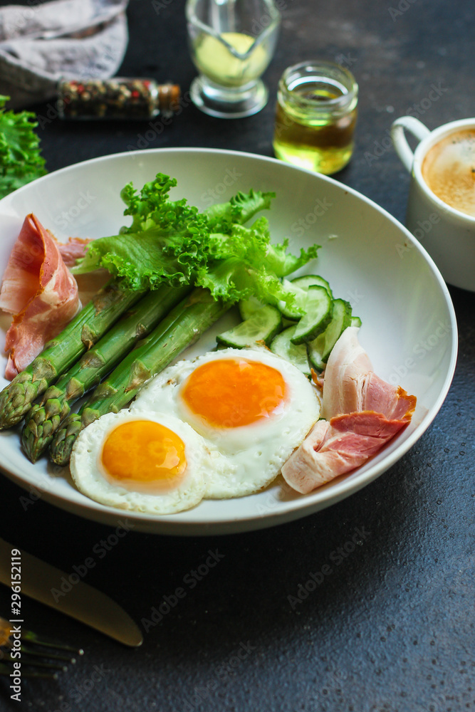 healthy breakfast (fried eggs, bacon, vegetables, asparagus beans, coffee and more) menu concept. food background. copy space. Top view healthy breakfast (fried eggs, bacon, vegetables, asparagus beans, coffee and more) menu concept. food background. copy space. Top view
