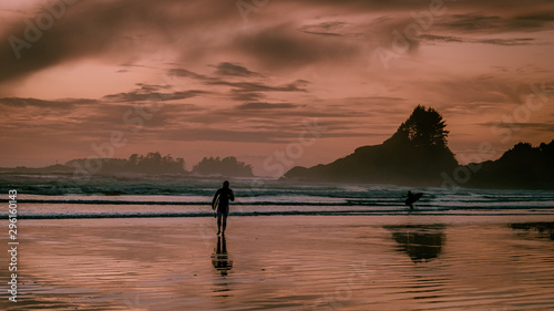 Tofino Vanacouver Island, sunset on the beach with surfers at Cox bay photo