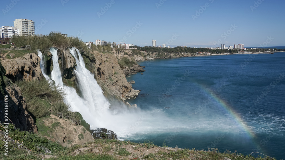 Waterfall Duden falling into the Mediterranean sea with rainbow scene, Antalya, Turkey Waterfall Duden falling into the Mediterranean sea with rainbow scene, Antalya, Turkey