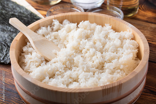 jaoanese sushi rice in wooden bowl with ingredients photo