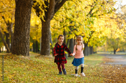 two girls in autumn park