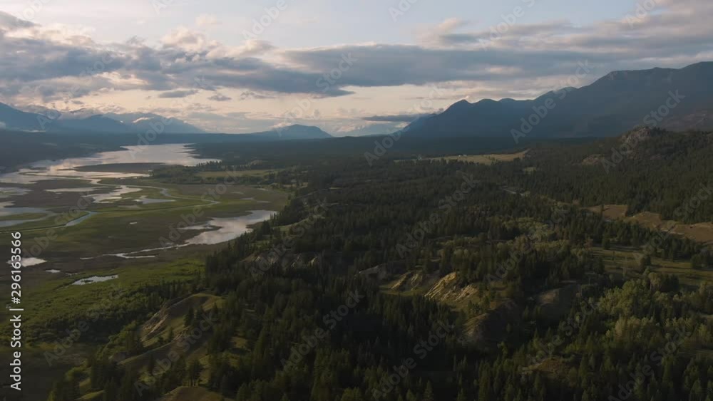 Aerial Panoramic View of Beautiful Canadian Landscape during a sunny summer sunset. Taken in Kootenay, British Columbia, Canada. Aerial Panoramic View of Beautiful Canadian Landscape during a sunny summer sunset. Taken in Kootenay, British Columbia, Canada.
