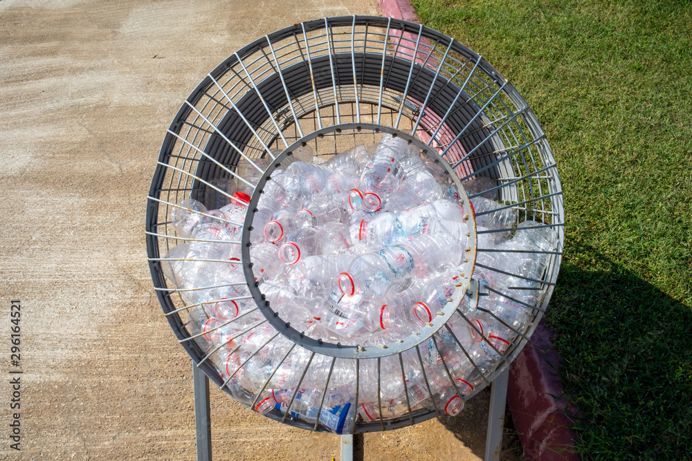 plastic bottles are collected in a metal basket