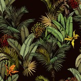 Seamless pattern with green tropical leaves and exotic flowers. Hand drawn vector illustration on black background.