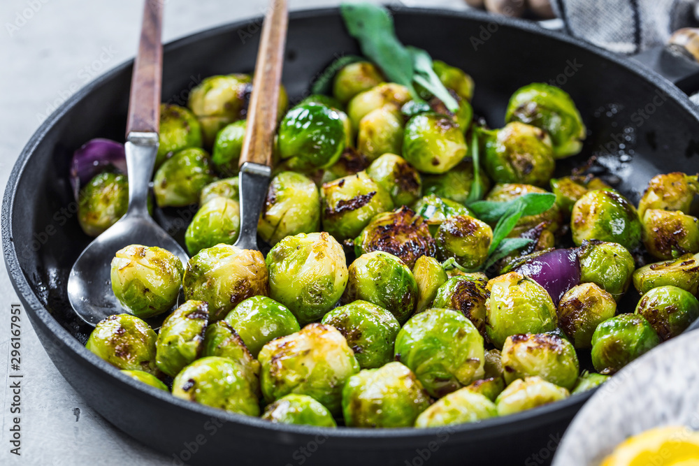 Frying pan with roasted brussel sprouts on table