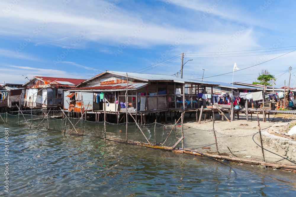 Old wooden houses and footbridges on stilts