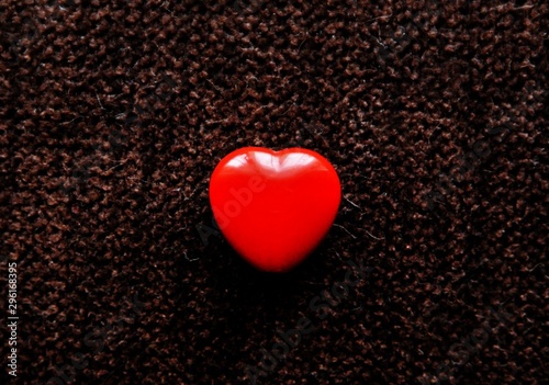a red heart on a dark background