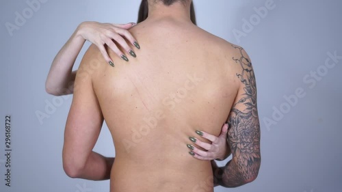 A girl and a guy are hugging half-naked. A woman stroking the back of a man.