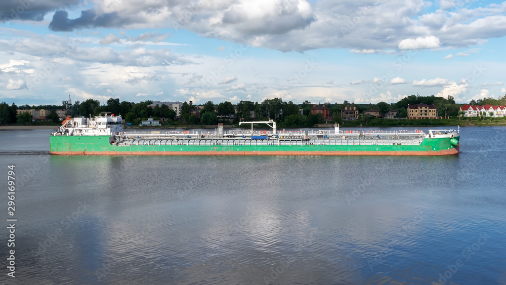 Big green ship on the river