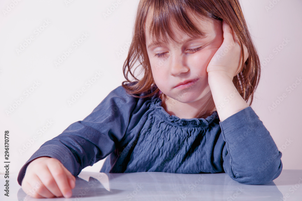 Very bored little cute child girl. Negative emotions, gestures, body language concept. Very bored little cute child girl. Negative emotions, gestures, body language concept.