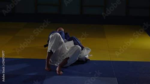 women are fighting on the tatami. judo