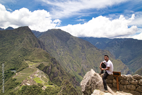 Traveller at the Lost city of the Incas, Machu Picchu,Peru on top of the mountain, with the view panoramic