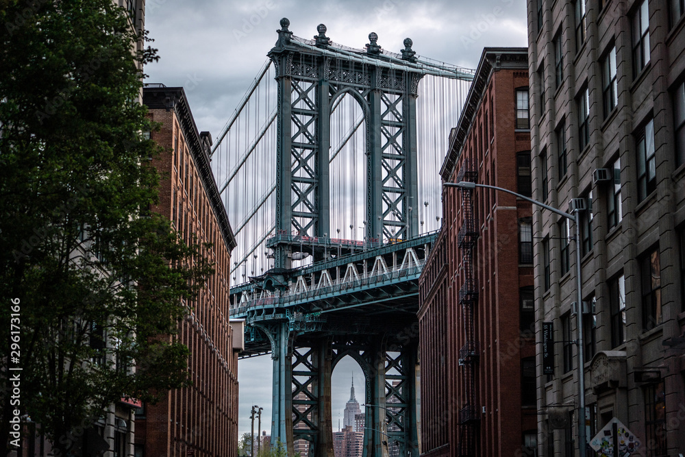 View of one of the towers of the Manhattan Bridge from the streets of the DUMBO district, Brooklyn, NYC 