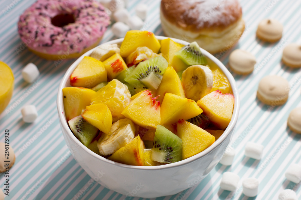 Fruit salad and sweets. Delicious and healthy breakfast.