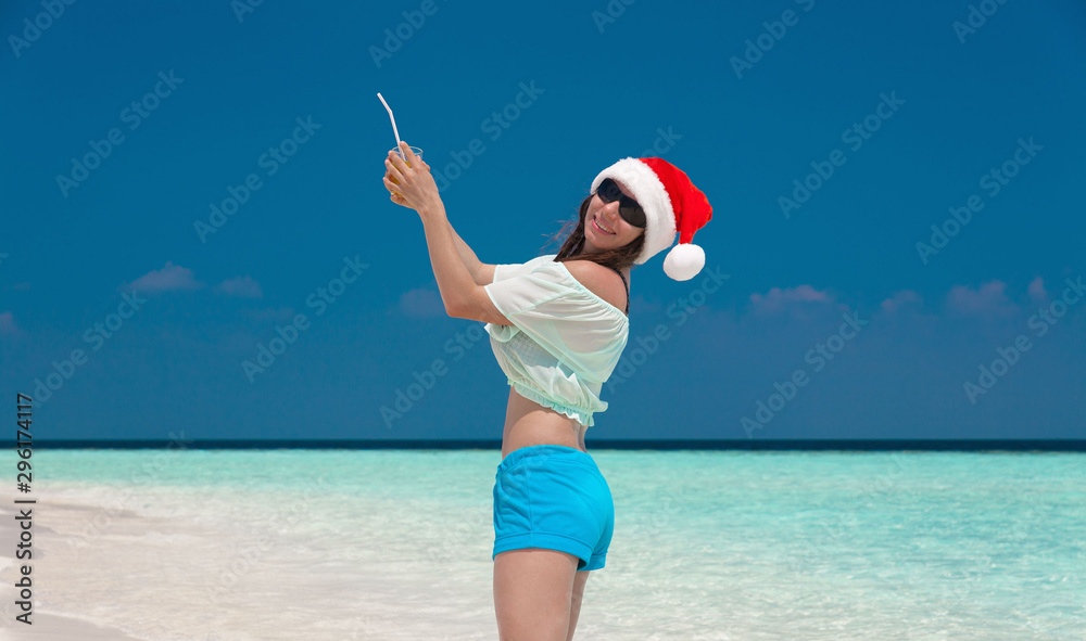 Maldives, woman Christmas hat, landscape