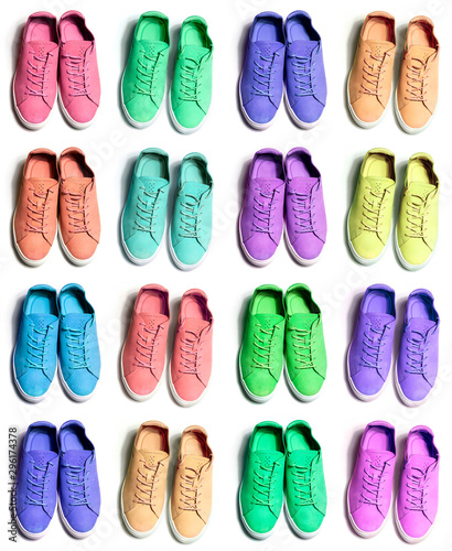 many colorful sneaker shoes on white background