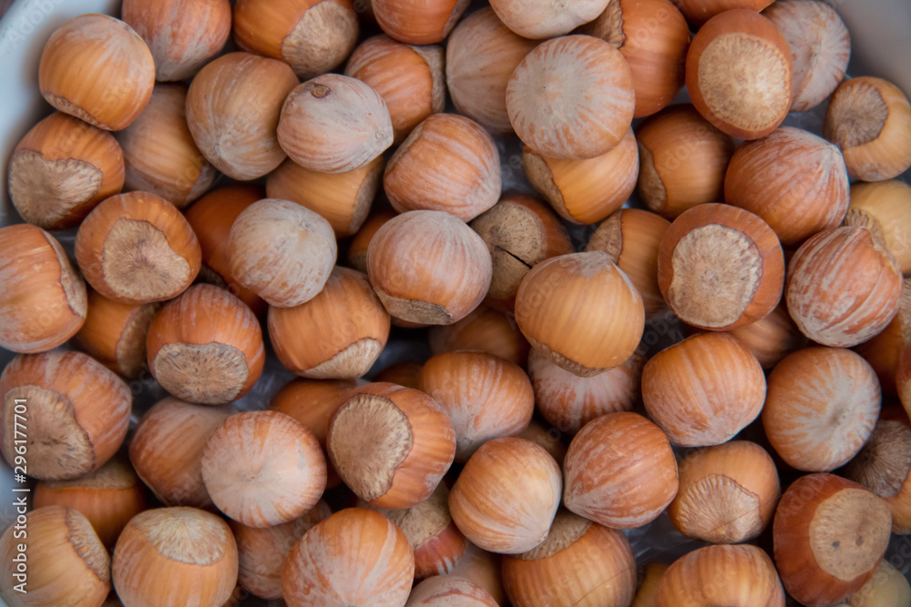 Food background. Hazelnuts texture. Top view . Hazelnut Nut Health Organic Brown Filbert Autumn Background Concept . Hazelnuts. Stack of hazelnuts. Food background. Hazelnuts texture. Top view . Hazelnut Nut Health Organic Brown Filbert Autumn Background Concept . Hazelnuts. Stack of hazelnuts.