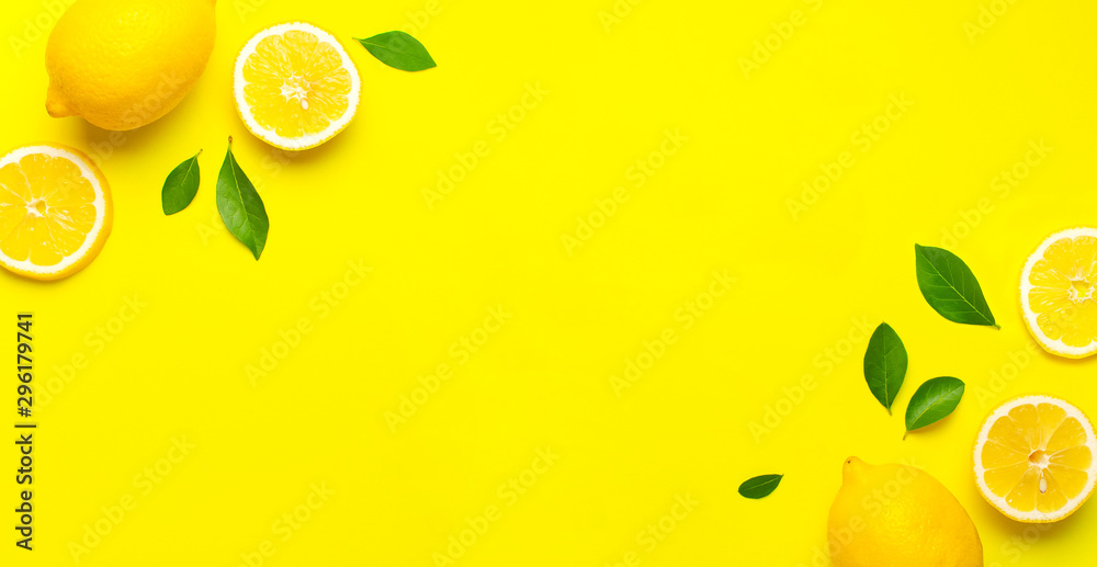 Creative background with fresh lemons and green leaves on bright yellow  background. Top view flat lay copy space. Lemon fruit citrus minimal  concept vitamin C. Composition with whole, slices of lemons Photos |