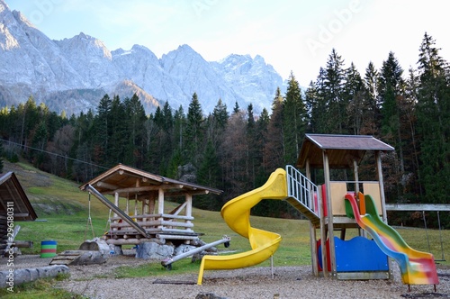 Children playground in park close to mountains