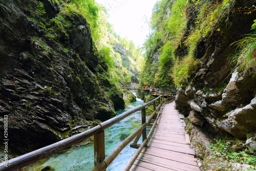 Vintgar Gorge with clear turquoise water stream equipped with wooden observation walkways and bridges close to Bled, Slovenia