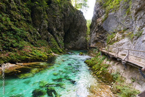 Valokuvatapetti Vintgar Gorge with clear turquoise water stream equipped with wooden observation