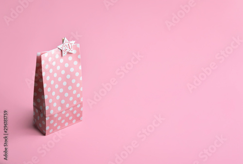 Pink gift bag with 24 number. Christmas advent calendar. Gifting