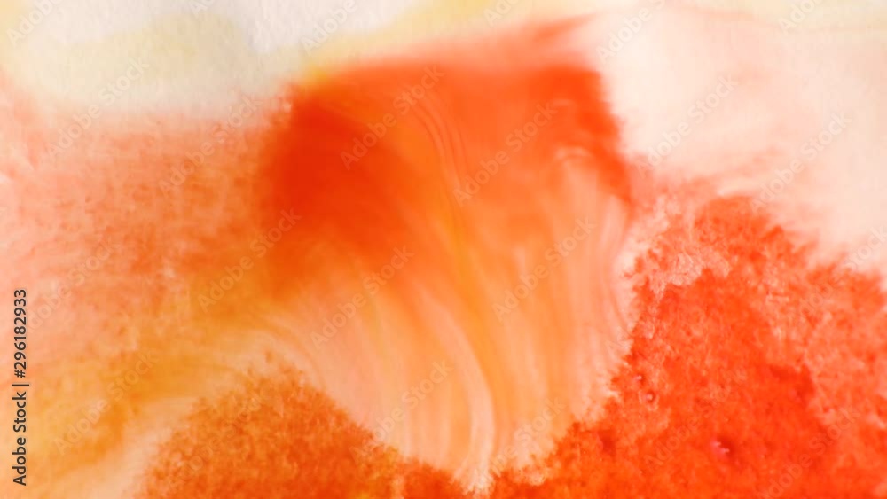 A stain of red watercolor paint on paper dipped in water. Macro photo. Background minimalistic vibrant image. The concept of drawing.