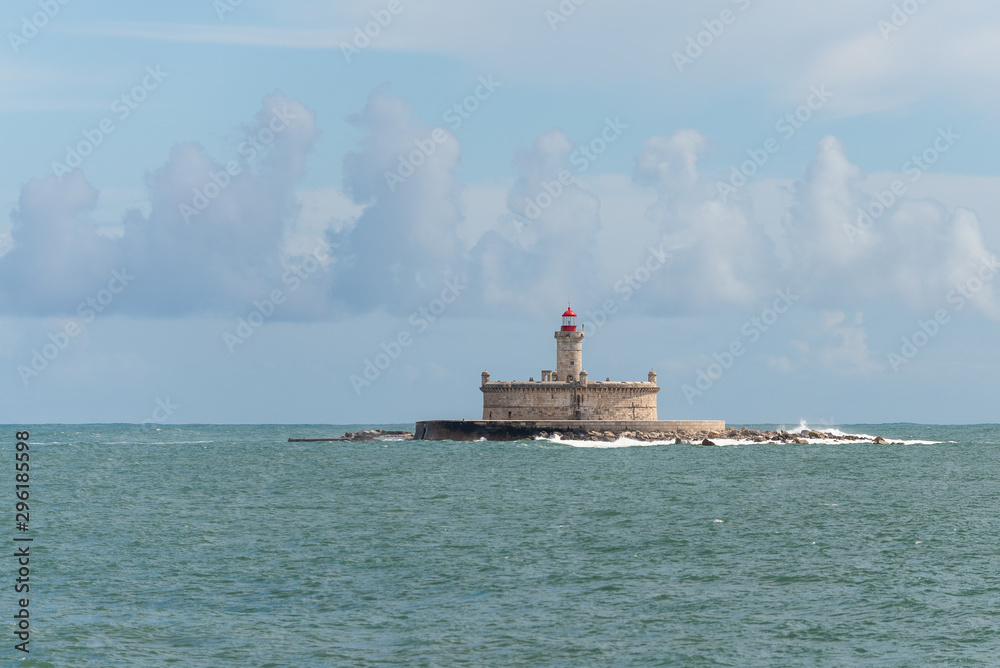 Lighthouse on small island at sea - The Fort of Sao Lourenco do Bugio Lighthouse on small island at sea - The Fort of Sao Lourenco do Bugio