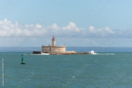Lighthouse on small island at sea - The Fort of Sao Lourenco do Bugio © Alexey Seafarer