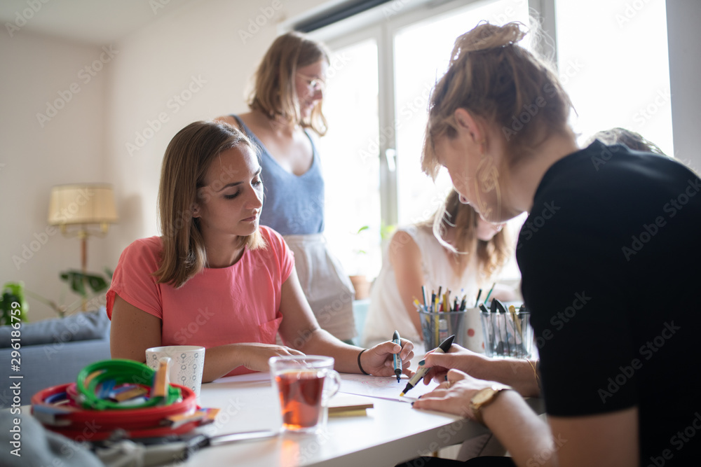 women at a creative cross stitching class 