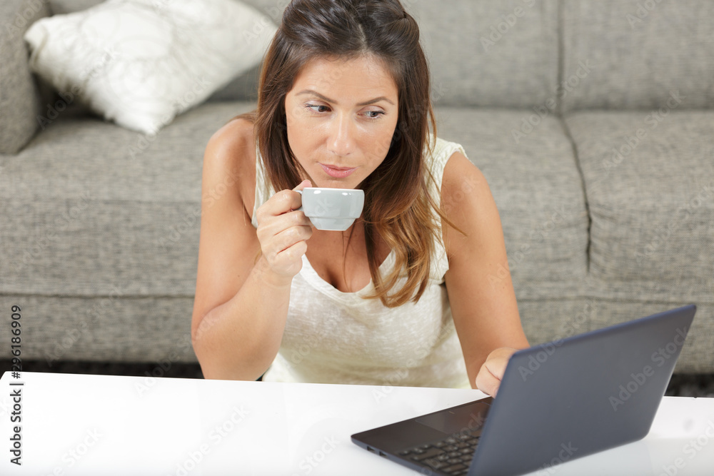young woman working at home with laptop and coffee young woman working at home with laptop and coffee