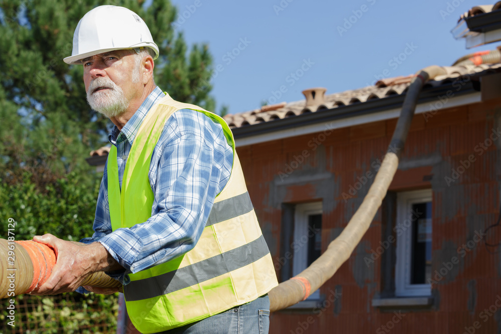 senior man working with construction pipes