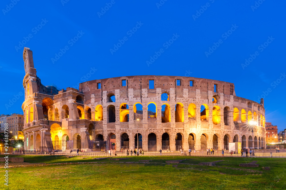 The Colosseum in Rome, Italy at sunset twilight. Blue hour photo in the evening. The world famous colosseum landmark in Rome.