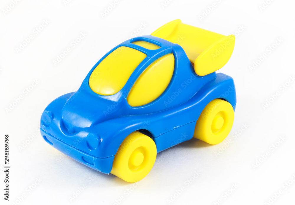 Blue plastic toy car with yellow wheels and yellow glass Blue plastic toy car with yellow wheels and yellow glass