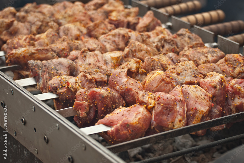 Barbecue fries in the coals. Meat and beef at the field kitchen festival.