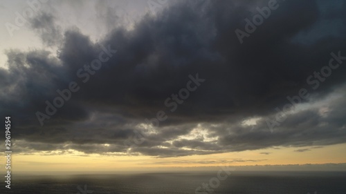 sunset stroking the clouds the sky the earth and the sea