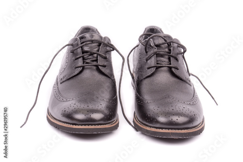 Black leather male shoes, white background. Men's ankle boot leather isolated on white background, closed up. For business and office. Official and casual, footwear. Front view. Closeup. Isolated.