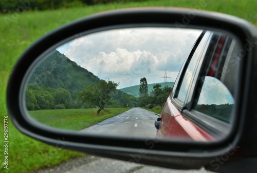 landscape seen through the rearview