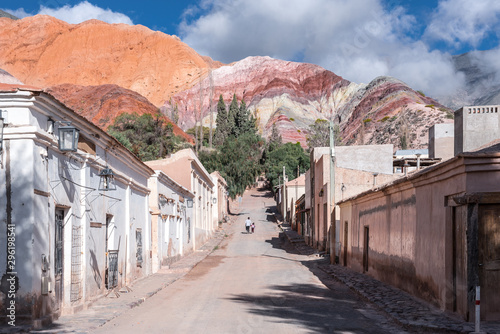 Purmamarca town and red mountains full of colours photo