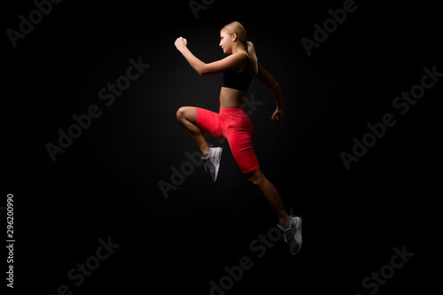 Life is motion. Woman athlete run achieve great result. How run faster. Speed training guide. Improve run speed. Girl runner on black background. Sport lifestyle and health concept. Start run
